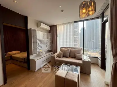 Modern living room with city view, stylish furniture, and natural light.
