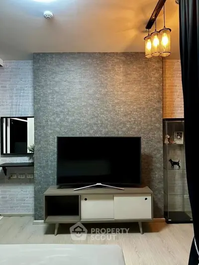 Modern living room with stylish TV setup and elegant lighting