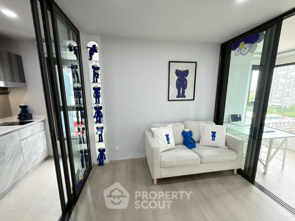 Modern living room with stylish decor and open kitchen layout in a contemporary apartment.