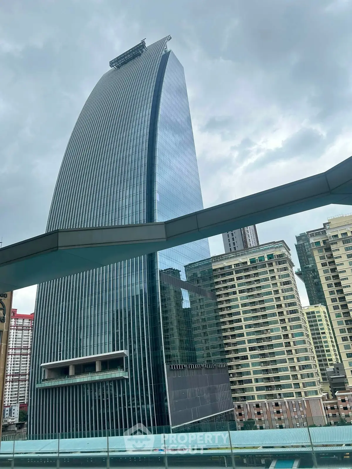 Stunning modern skyscraper with sleek glass facade in urban skyline
