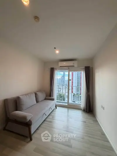 Modern living room with sofa and city view through large window
