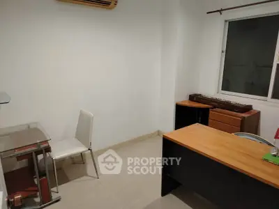 Minimalist study room with desk and chair, ideal for focused work.