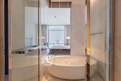 Luxurious bathroom with modern bathtub and city view
