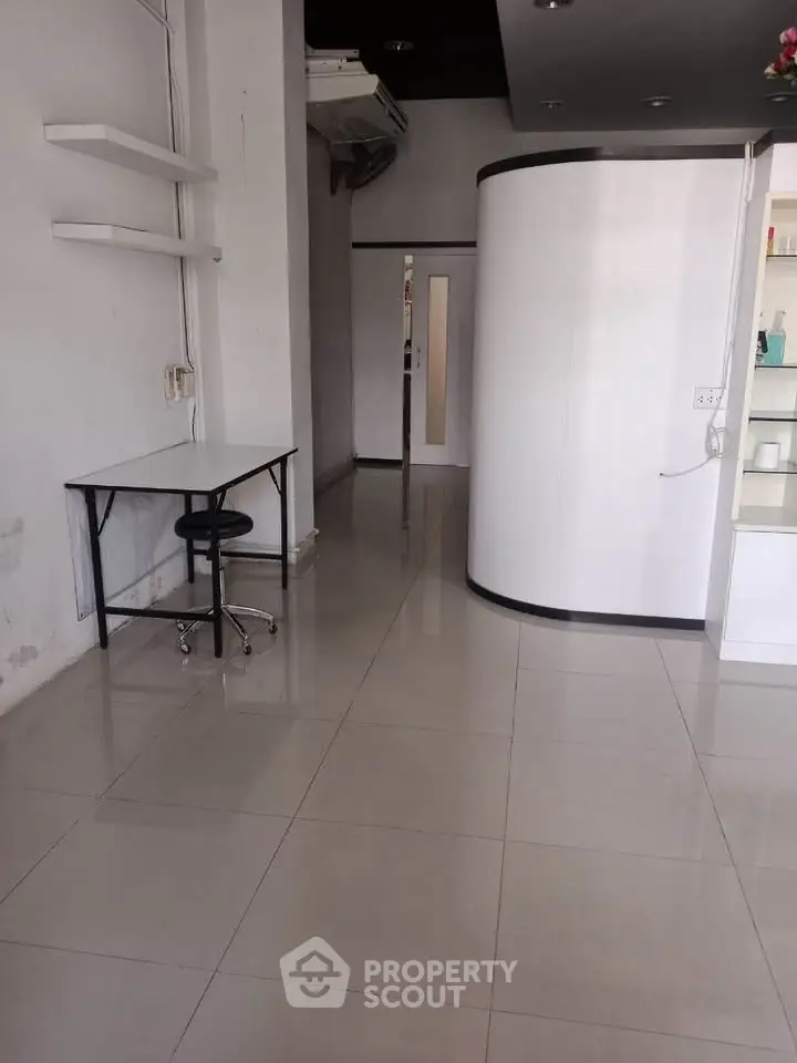 Spacious interior with modern design and sleek tiled flooring