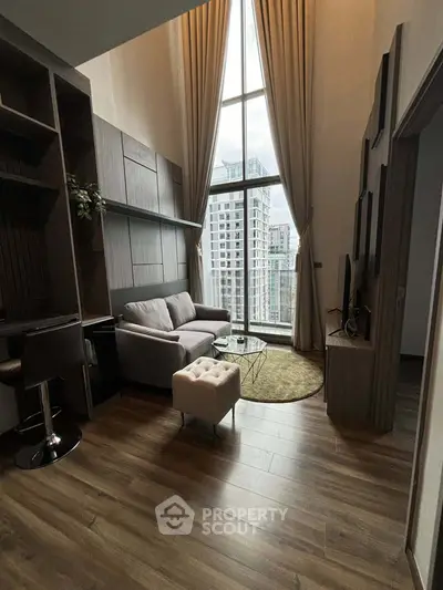 Luxurious high-ceiling living room with stunning city view and elegant decor.