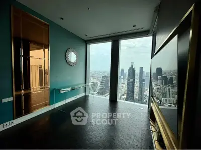 Luxurious high-rise living room with stunning cityscape view and modern decor.