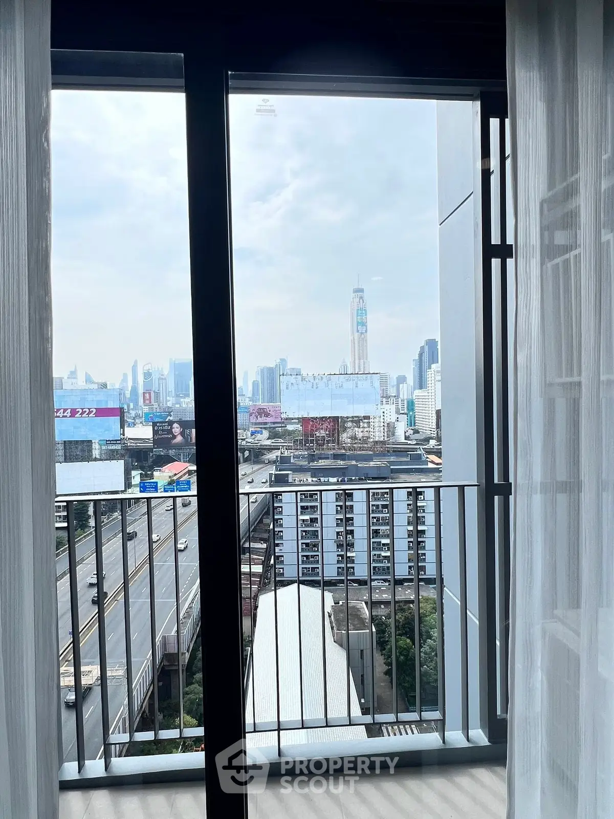 Stunning city view from modern apartment balcony with skyline backdrop