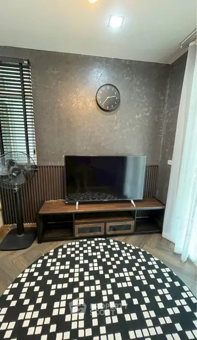 Modern living room with stylish decor and flat-screen TV