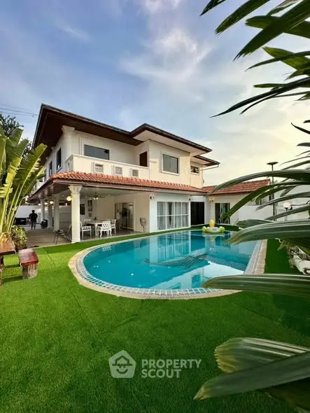 Luxurious villa with private pool and lush garden, perfect for relaxation and entertaining.