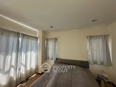 Cozy bedroom with natural light and modern decor