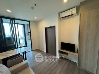 Modern living room with balcony view and sleek interior design