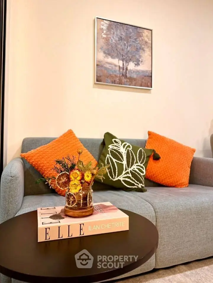 Cozy living room with stylish sofa and vibrant decor accents