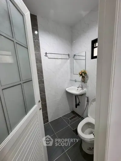 Compact modern bathroom with sleek design and elegant fixtures