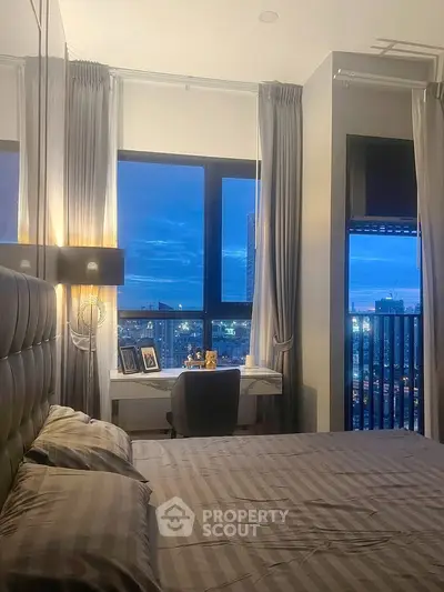 Modern bedroom with city view and stylish decor, perfect for urban living.