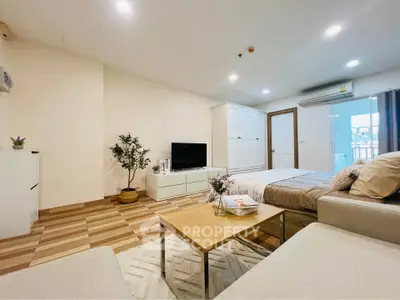 Spacious modern living room with cozy decor and natural light