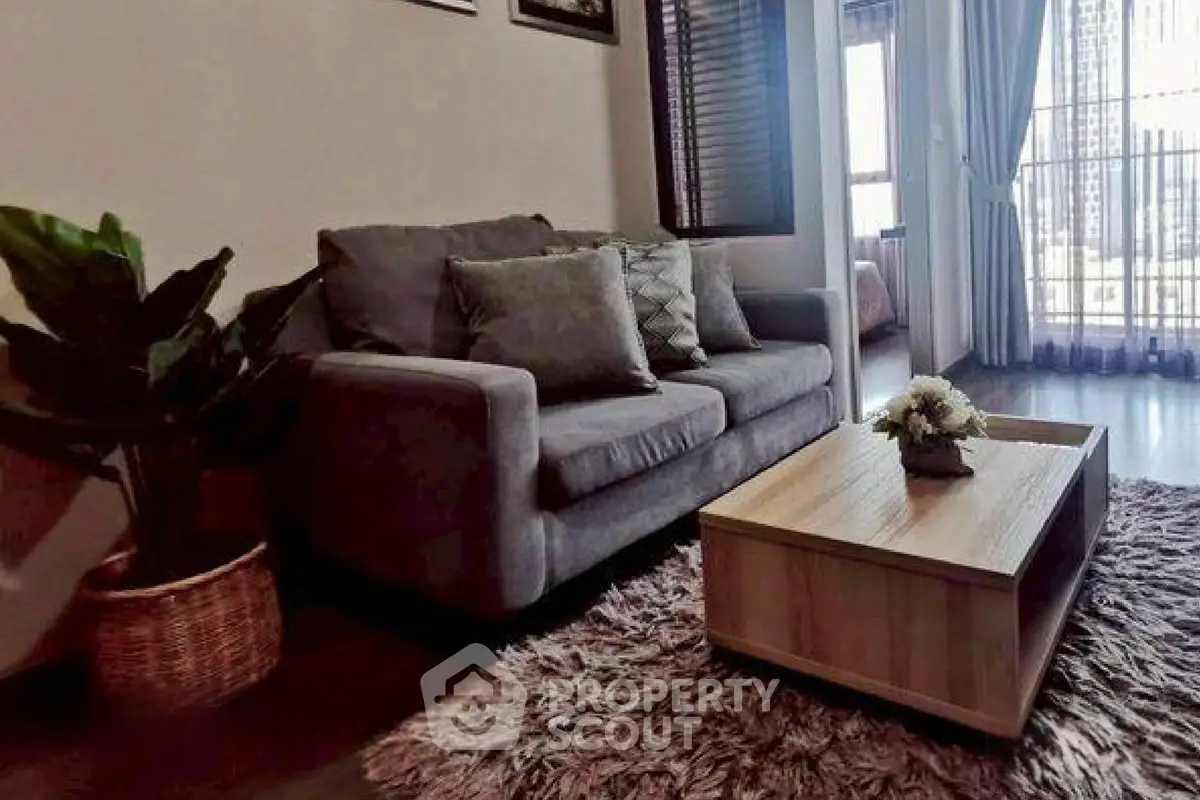 Cozy living room with plush sofa and stylish coffee table in modern apartment