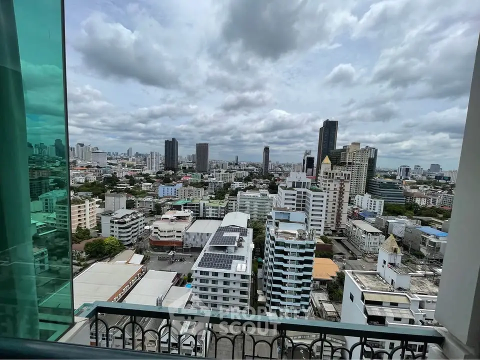 Stunning cityscape view from high-rise balcony in urban setting