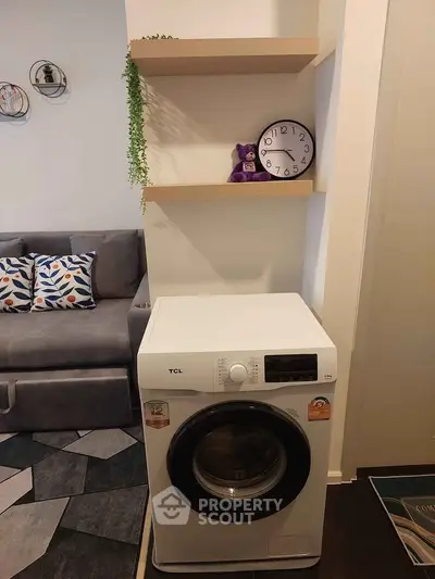 Modern living room with washing machine and stylish decor