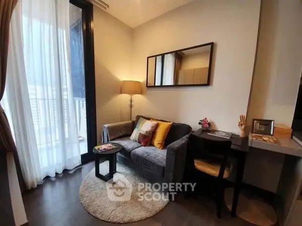 Cozy living room with modern decor and balcony access