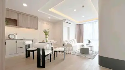 Modern open-plan living room with elegant dining area and natural light