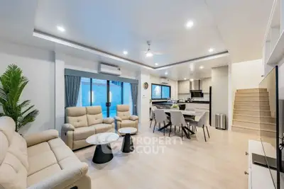 Spacious modern living room with open kitchen and elegant decor