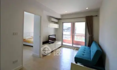 Modern living room with balcony access and stylish furniture