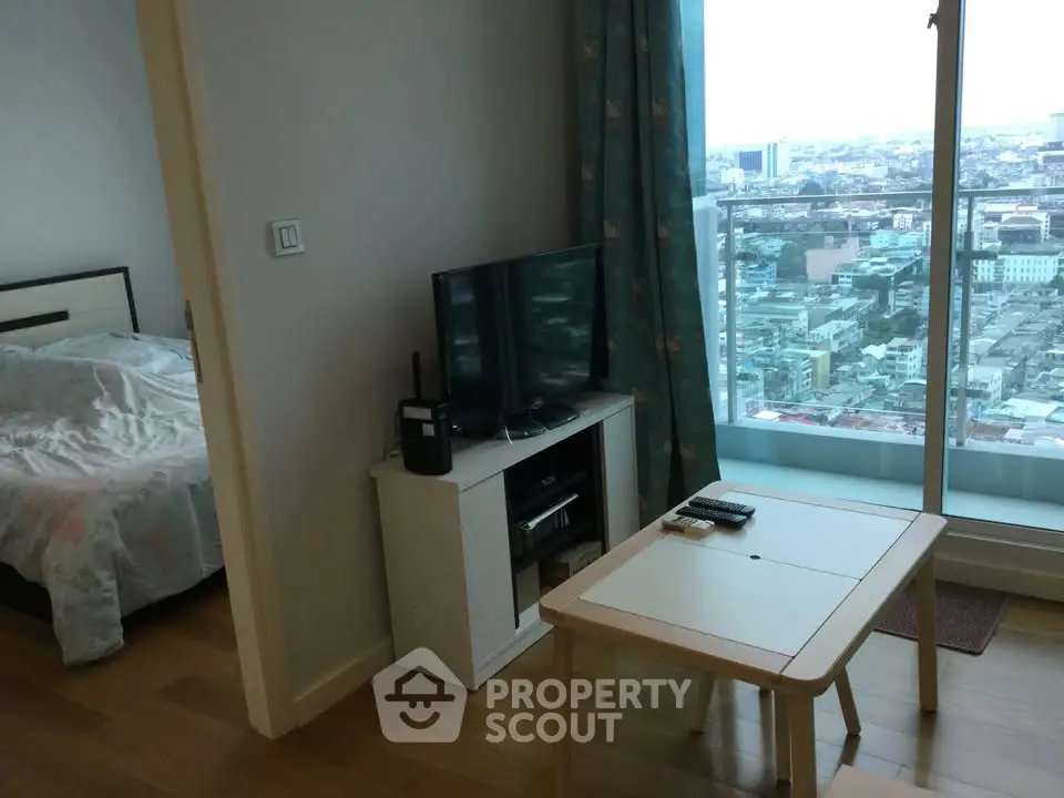 Modern apartment with city view, featuring cozy living area and bedroom, ideal for urban living.