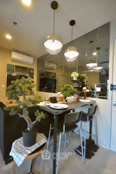Stylish modern kitchen with elegant lighting and mirrored backsplash