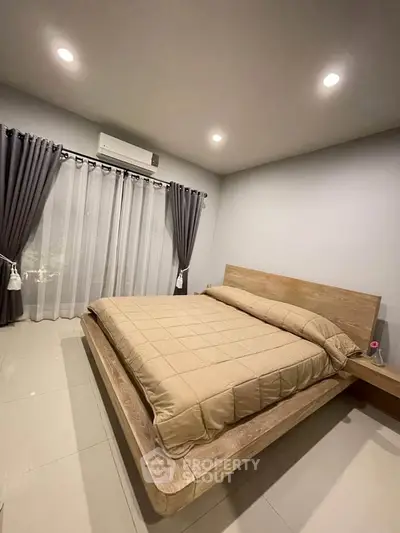 Modern bedroom with minimalist wooden bed and elegant curtains
