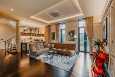 Luxurious living room with elegant decor, plush seating, and ambient lighting.