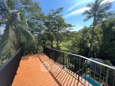 Spacious balcony with stunning lush greenery view, perfect for relaxation and outdoor enjoyment.