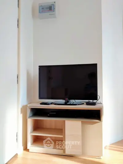 Modern living room with sleek TV stand and flat-screen television