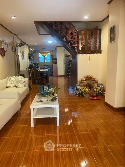 Spacious living room with wooden flooring and modern decor
