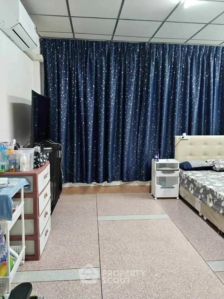 Cozy bedroom with starry curtains and modern furnishings