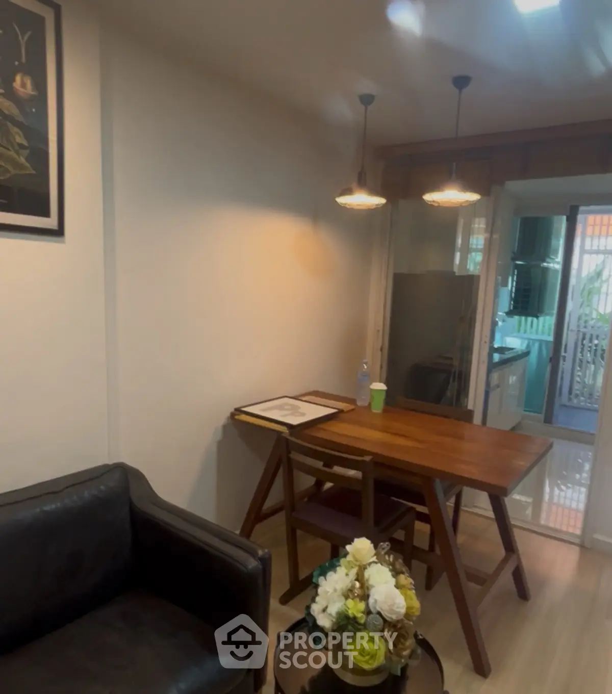 Cozy living area with modern furniture and open kitchen layout