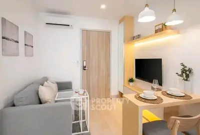 Modern living room with cozy seating and stylish dining area in a contemporary apartment.