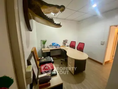 Modern office space with unique decor and ergonomic chairs, perfect for a productive work environment.