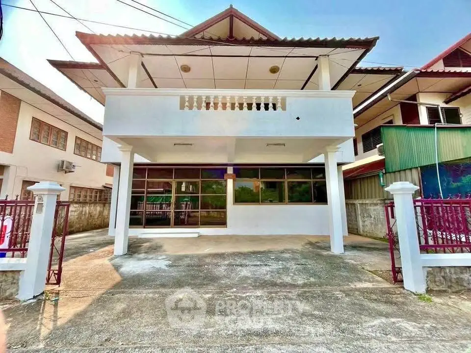Charming two-story house with spacious driveway and modern facade in a serene neighborhood.