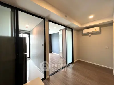 Modern apartment interior with sliding glass doors and air conditioning