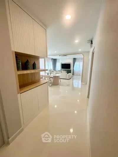 Spacious modern living room with elegant decor and open layout, perfect for entertaining.