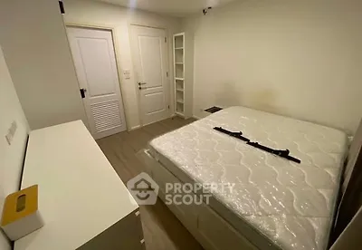 Cozy bedroom with new mattress and modern white furniture
