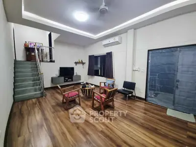 Spacious living room with wooden flooring and modern decor