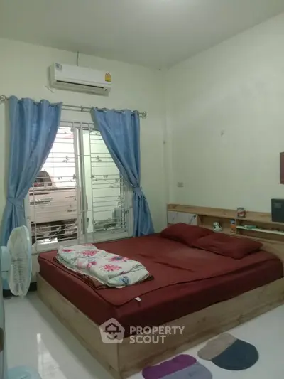 Cozy bedroom with modern air conditioning and stylish decor