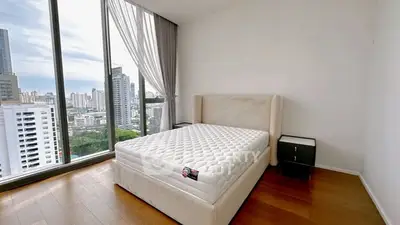 Modern bedroom with panoramic city view and elegant decor