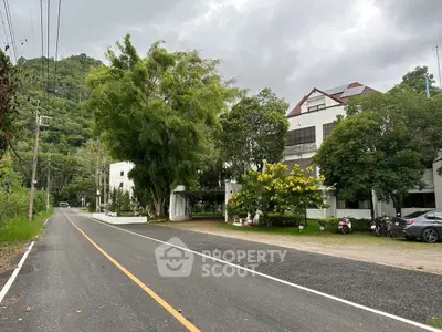 Charming countryside property with lush greenery and spacious driveway