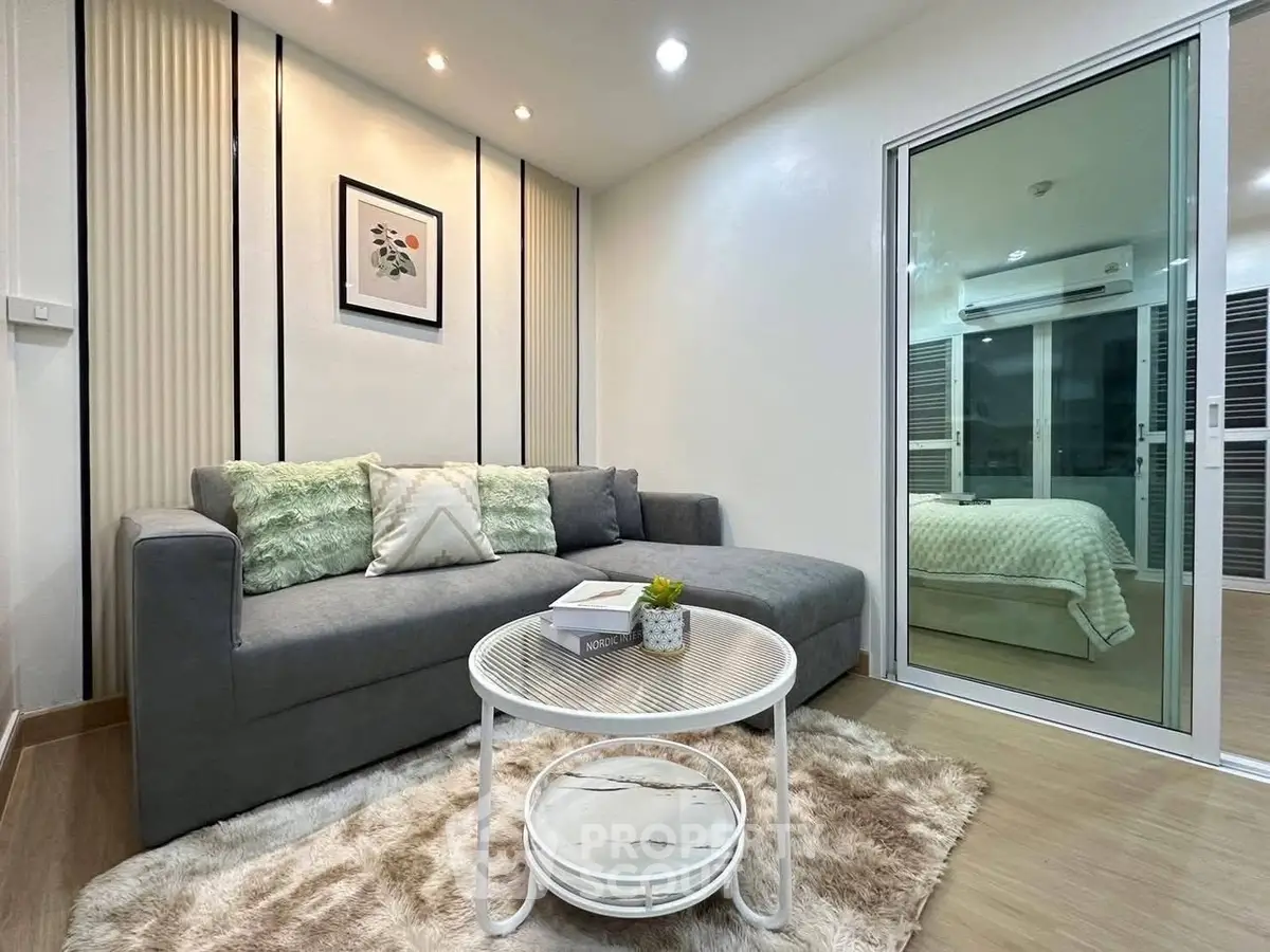 Modern living room with cozy gray sofa and stylish decor