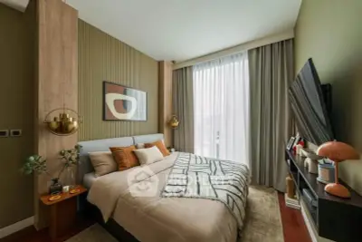 Stylish modern bedroom with cozy decor and large window for natural light.