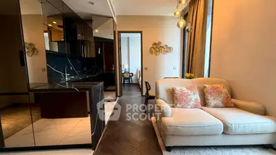 Modern living room with elegant sofa and open kitchen layout in luxury apartment