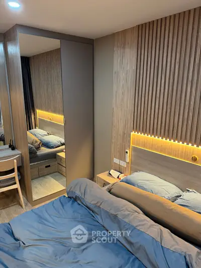 Modern bedroom with stylish wood paneling and cozy lighting