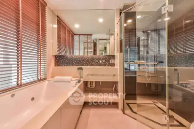 Luxurious modern bathroom with glass shower and large bathtub